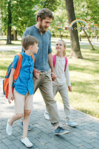 Father walking kids to school