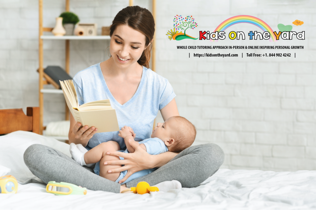 Young mom reading a book to her infant baby.