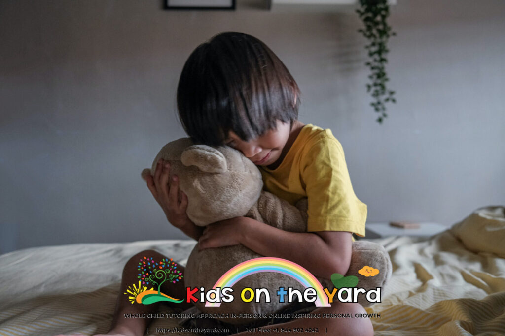 Kid hugging teddy bear