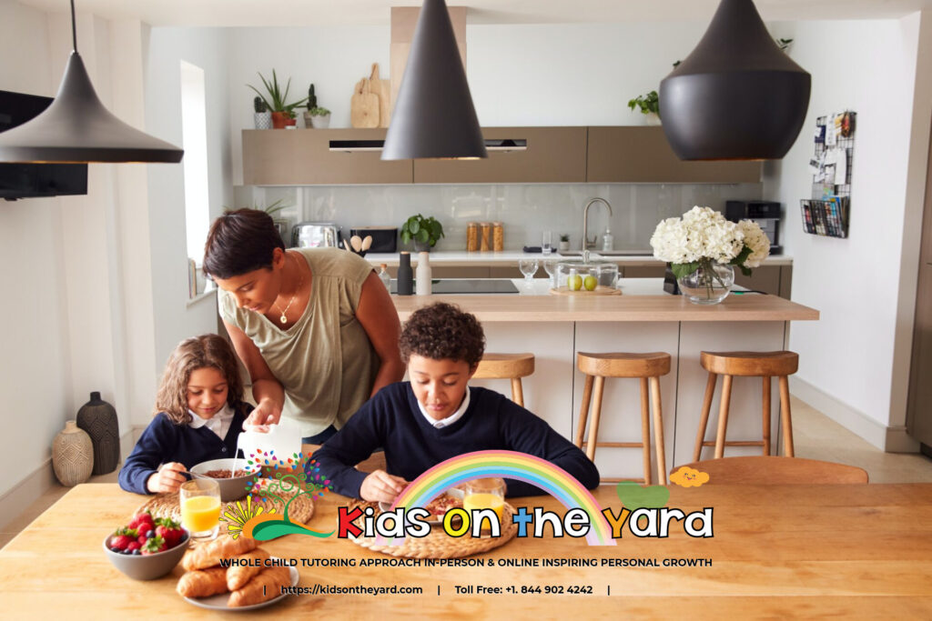 Mother In Kitchen Helping Children With Breakfast Before Going To School